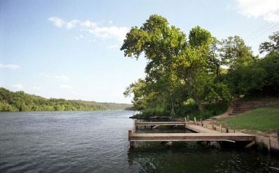Boat ramp dock at Lakeside Park beside the boat launch, with a bench overlooking Lake Austin.