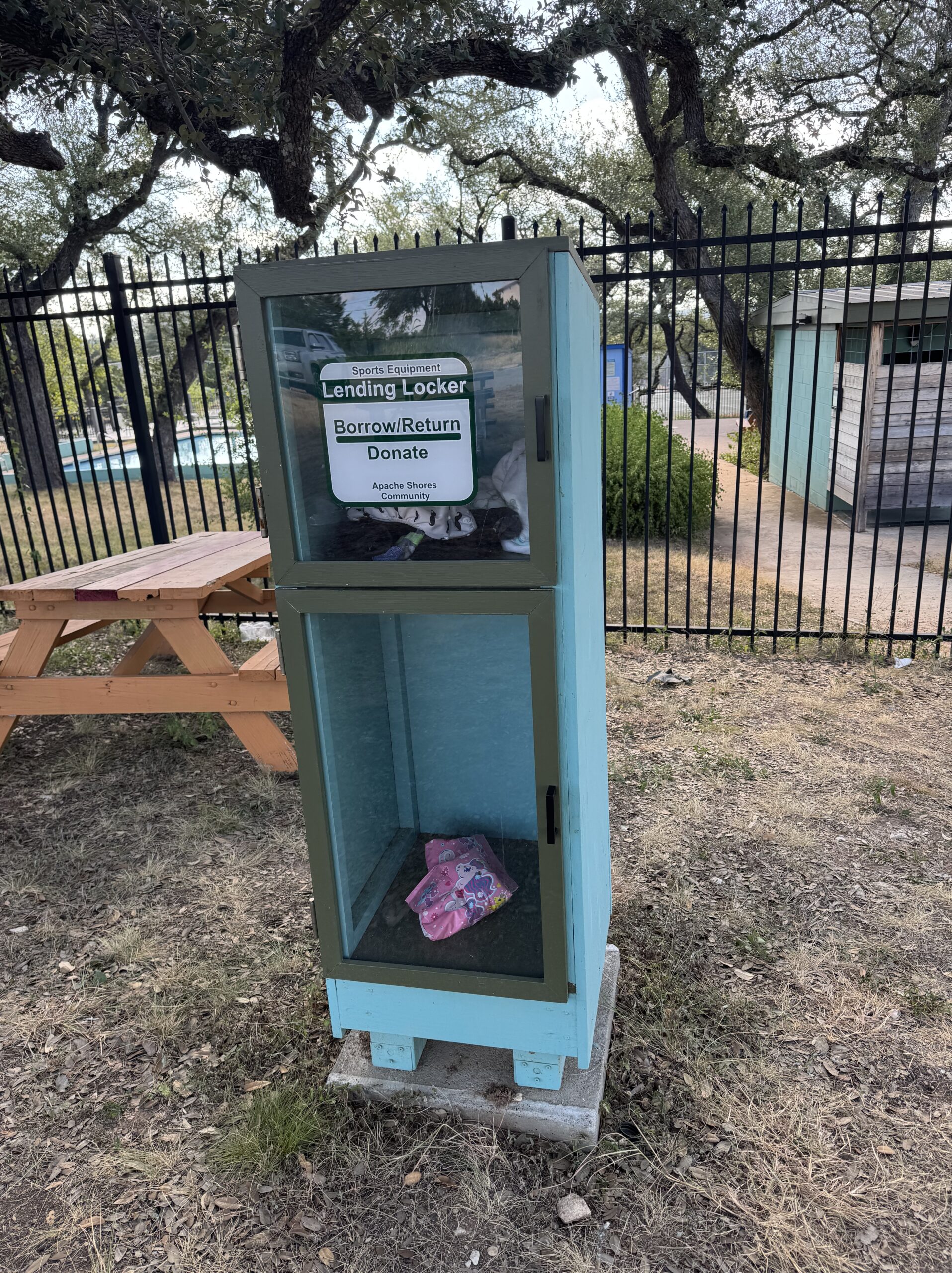 Wooden Lost & Found Library at the Apache Shores pool for storing items left behind by visitors.