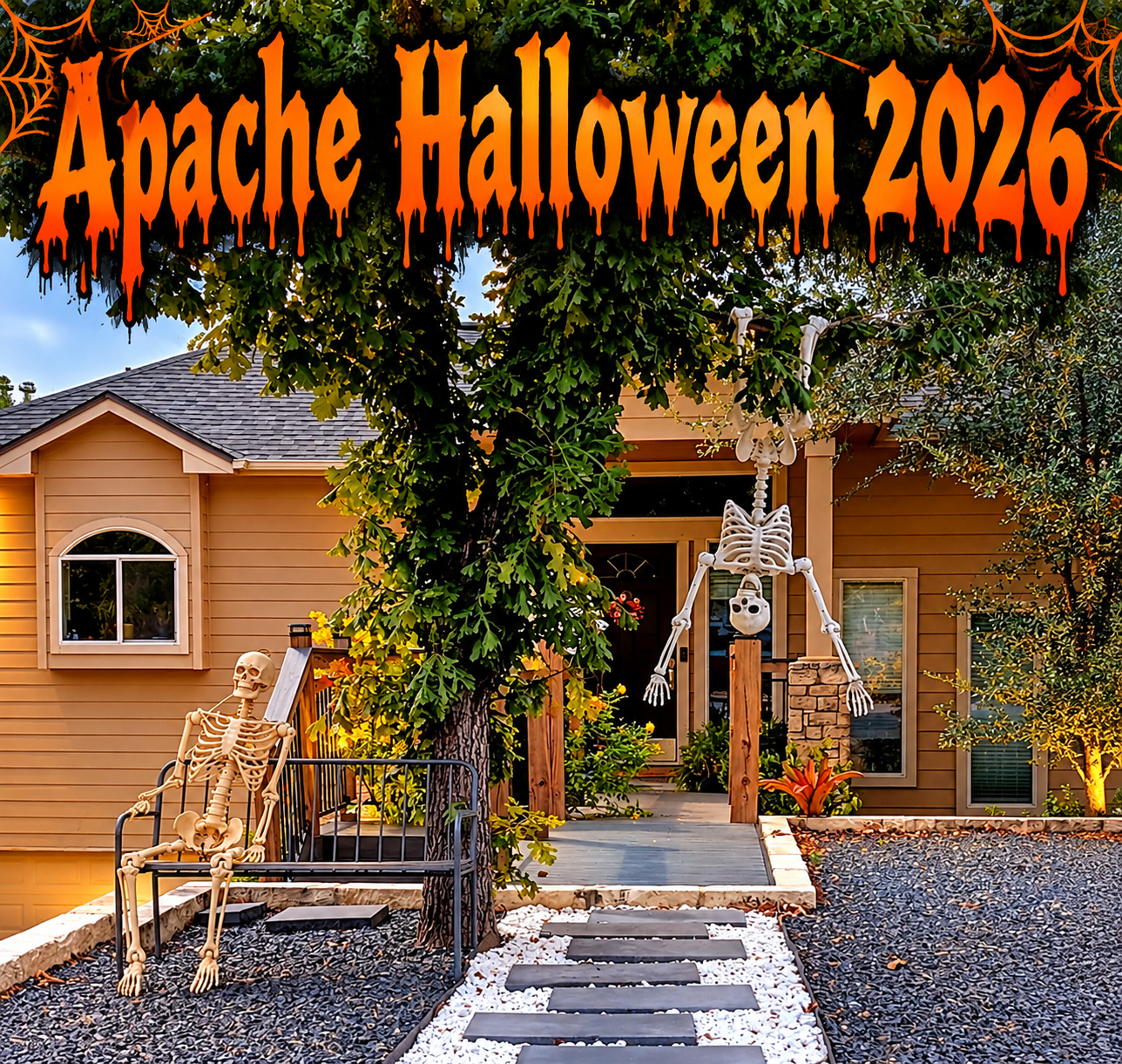 Halloween decorations at a home on Broken Bow in Apache Shores, with one skeleton sitting on a bench and another hanging upside down near the front porch.
